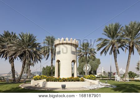 MEZAIRAA, UAE - DEC 4, 2016: Replica of a traditional arabian tower in a roundabout in Mezairaa. Liwa Oasis area Emirate of Abu Dhabi United Arab Emirates