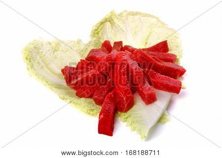 Raw Sliced Meat On A Cabbage Leaf