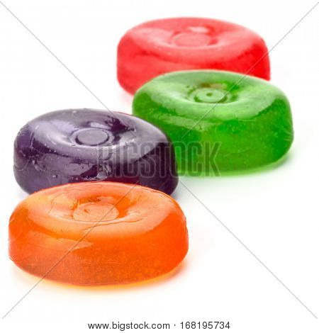 Four colorful fruit hard sugar candies,  boiled sweeties or sugar plums isolated on white background cutout