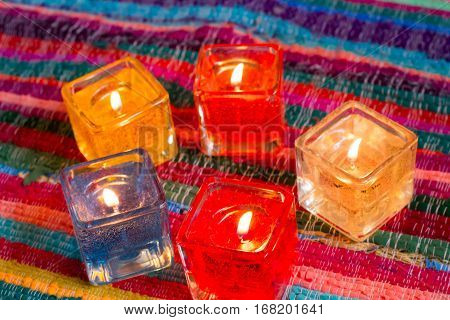 red yellow orange white  blue candle .