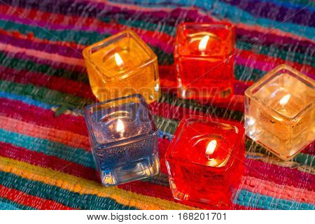 red yellow orange white  blue candle .