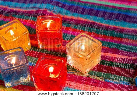 red yellow orange white  blue candle .