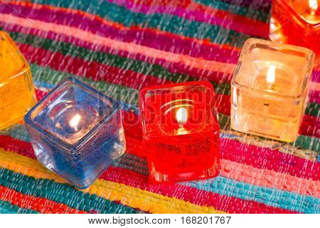 red yellow orange white  blue candle .