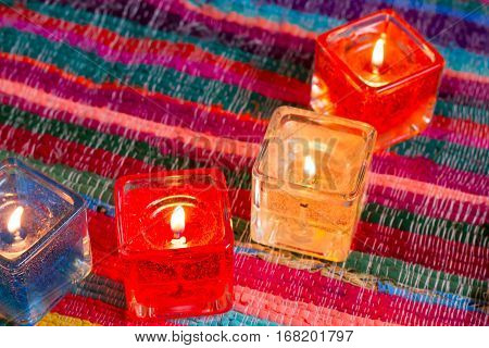 red yellow orange white  blue candle .