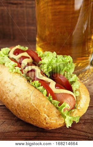Hot Dog With Glass Of Beer On Wooden Board