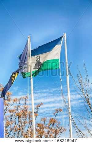 In The Cloudy Sky Waving Flag
