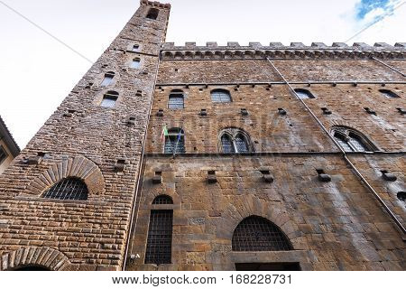 travel to Italy - wet wall of Bargello palace (Palazzo del Bargello Palazzo del Popolo Palace of the People) in Florence city after rain