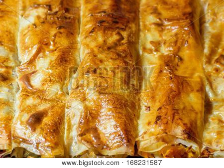 Homemade sliced pie with pumpkin and plums. Traditional eastern food