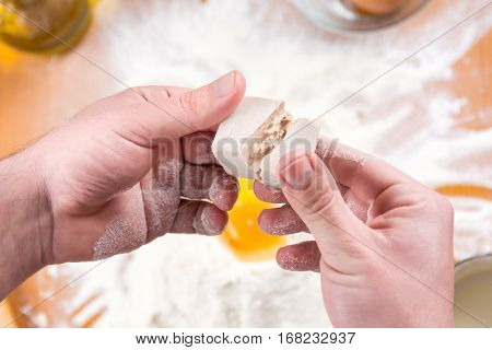 Man Spiting Yeast In Dough Making