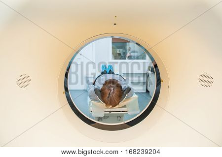 Close Up Patient At Ct Scan Tomography In Hospital, Shot Through The Tube Of Device. Selective Focus