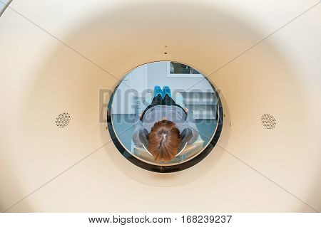 Close Up Patient At Ct Scan Tomography In Hospital, Shot Through The Tube Of Device. Selective Focus