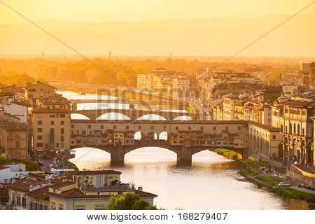 River Arno And Famous Bridge Ponte Vecchio
