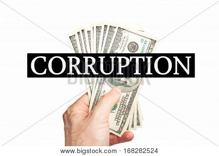 Male hand holing dollars with message CORRUPTION