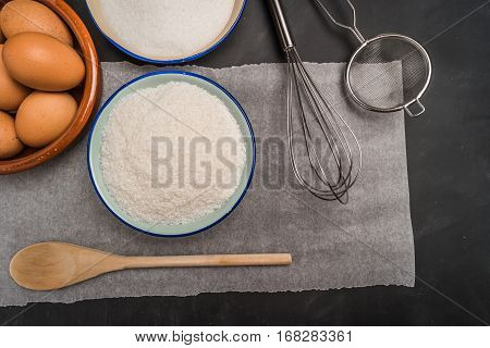 Ingredients for baking a cookies. Recipe for coconut macaroons. Top view with copy space.