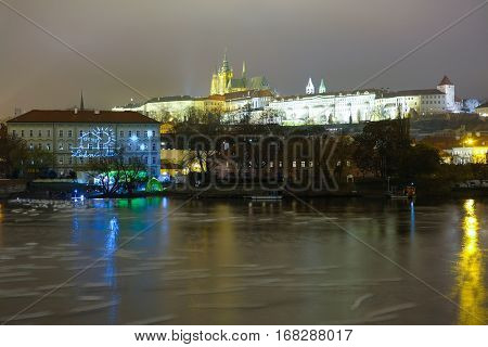 Prague, Czechia - November, 21, 2016: Panorama of an old Prague, bridges and embankment of Vitava river, Czechia in a night