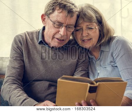 Mature Couple Reading Books Together
