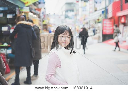 Beautiful Asian girl walking in the cityAmeyoko Shopping Street tokyo japan