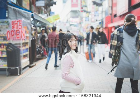 Beautiful Asian girl walking in the cityAmeyoko Shopping Street tokyo japan