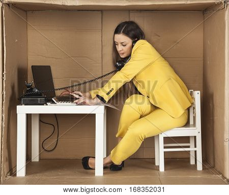 Business Woman Talking On The Phone And Checking E-mail