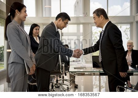 Business Partners Introductionary Handshake Bow