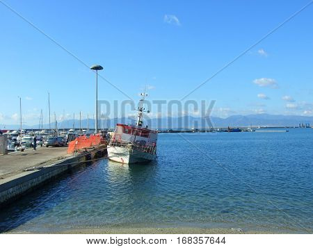 Flooded restaurant in the harbour. Sardynia, Italy. November, 2016.