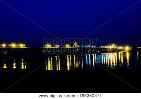 the bridge over the River with flashlights at night view