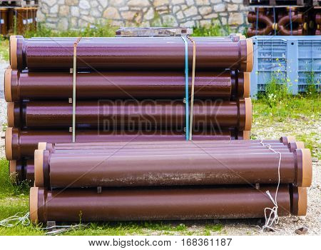 Stack sewerage tubes vitrified clay on building deposit