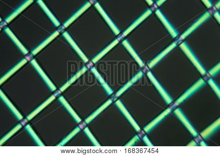A net of polylactic acid under the microscope and in polarized light. Polylactic acid is a bioactive and biodegradable polymer made of renewable resources.