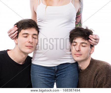 Young Pregnant Woman Posing With Two Young Man