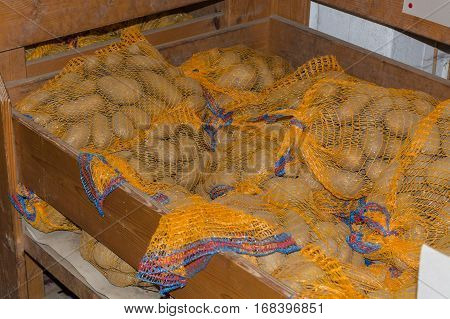 Freshly harvested from the field delicious potatoes a local market products. In a rustic farmer's market.