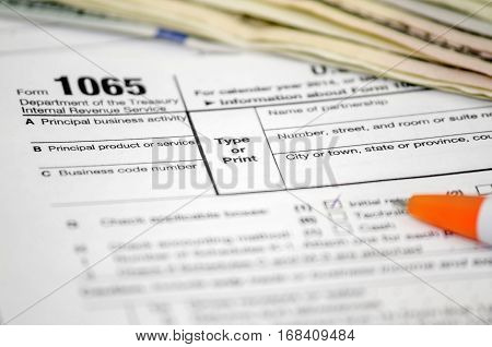 Tax forms 1065 dollar pen close up
