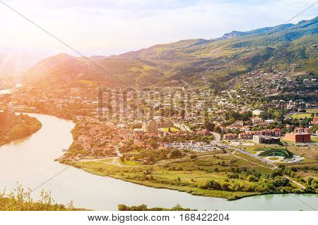 The picturesque landscape with the confluence of the rivers Kura and Aragvi (Mtskheta) in Georgia under the sun