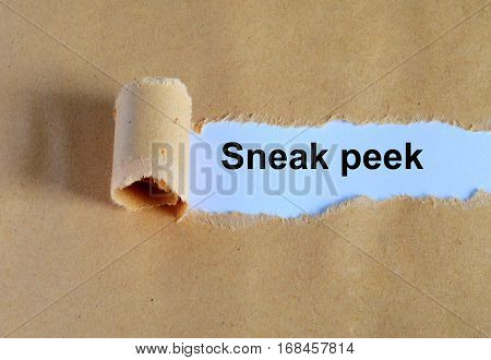Sneak Peek Word Written Under Ripped And Torn Paper.