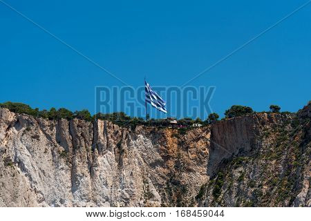 Greece national flag on the coast of Zakynthos Island