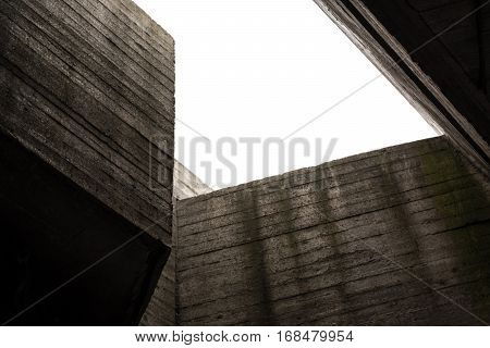 A concrete construction with hole in ceiling