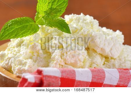 bowl of crumbly white cheese - detail