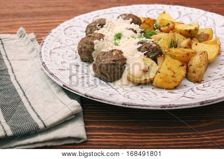 Beef meatballs with potatoes and creamy gravy.. Home-made healthy eating dish.
