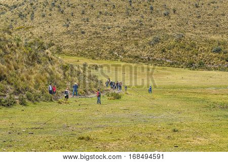 COTOPAXI, ECUADOR, FEBRUARY - 2016 - Group of people trekking a trail at Cotopaxi national park Ecuador