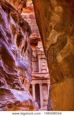 Outer Siq Rose Red Pink Treasury Afternoon Petra Jordan Petra Jordan. Treasury built by the Nabataens in 100 BC. Yellow Canyon becomes rose red when sun goes. The rose red can become blood red. Reds are created by magnesium in sandstone.