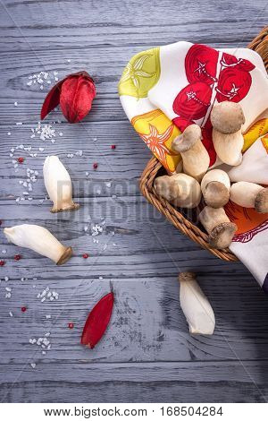 King oyster mushroom Pleurotus eryngii on the gray wooden background. Rustic style