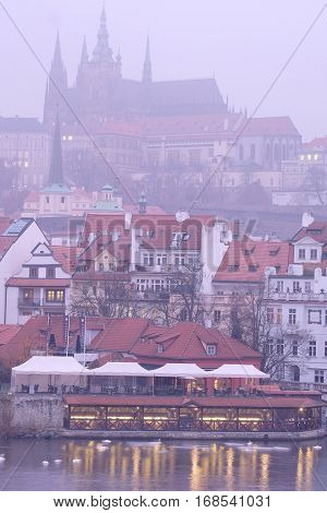 Prague, Czechia - November, 21, 2016: Panorama of an old Prague, bridges and embankment of Vitava river, Czechia in a night