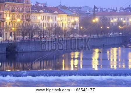 Panorama of an old Prague, bridges and embankment of Vitava river, Czechia in a night