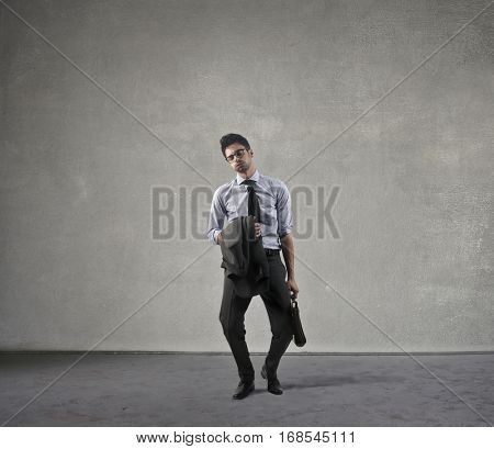 Businessman took off most of is business accecories, feeling tired