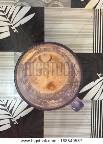 Top angle of teh tarik or milk tea.Its name is derived from the pouring process of "pulling" the drink during preparation.