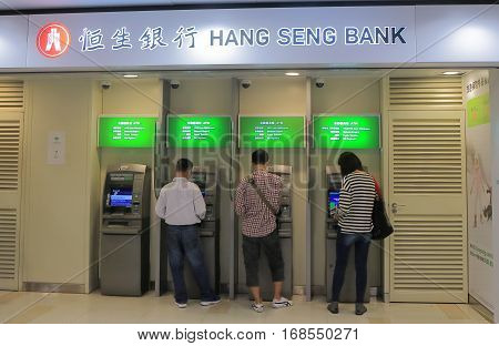 HONG KONG - NOVEMBER 9, 2016: Unidentified people use Hang Seng bank ATM. Hang Seng bank is a Hong Kong based banking and financial services company.