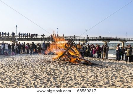 People Watch The Easter Fire At The Beach