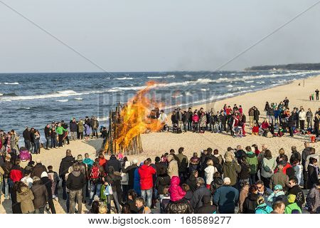 People Watch The Easter Fire At The Beach
