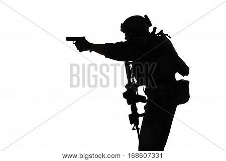 United states Marine Corps special operations command Marsoc raider with weapon aiming pistol. Silhouette of Marine Special Operator white background