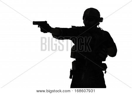 United states Marine Corps special operations command Marsoc raider with weapon aiming pistol. Silhouette of Marine Special Operator white background