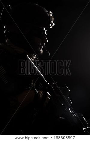 United states Marine Corps special operations command Marsoc raider. Contour backlit studio shot of Marine Special Operator black background